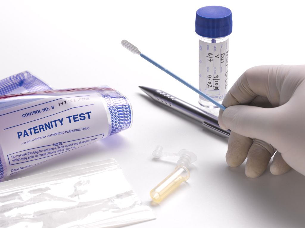 Taking DNA swab for paternity test.