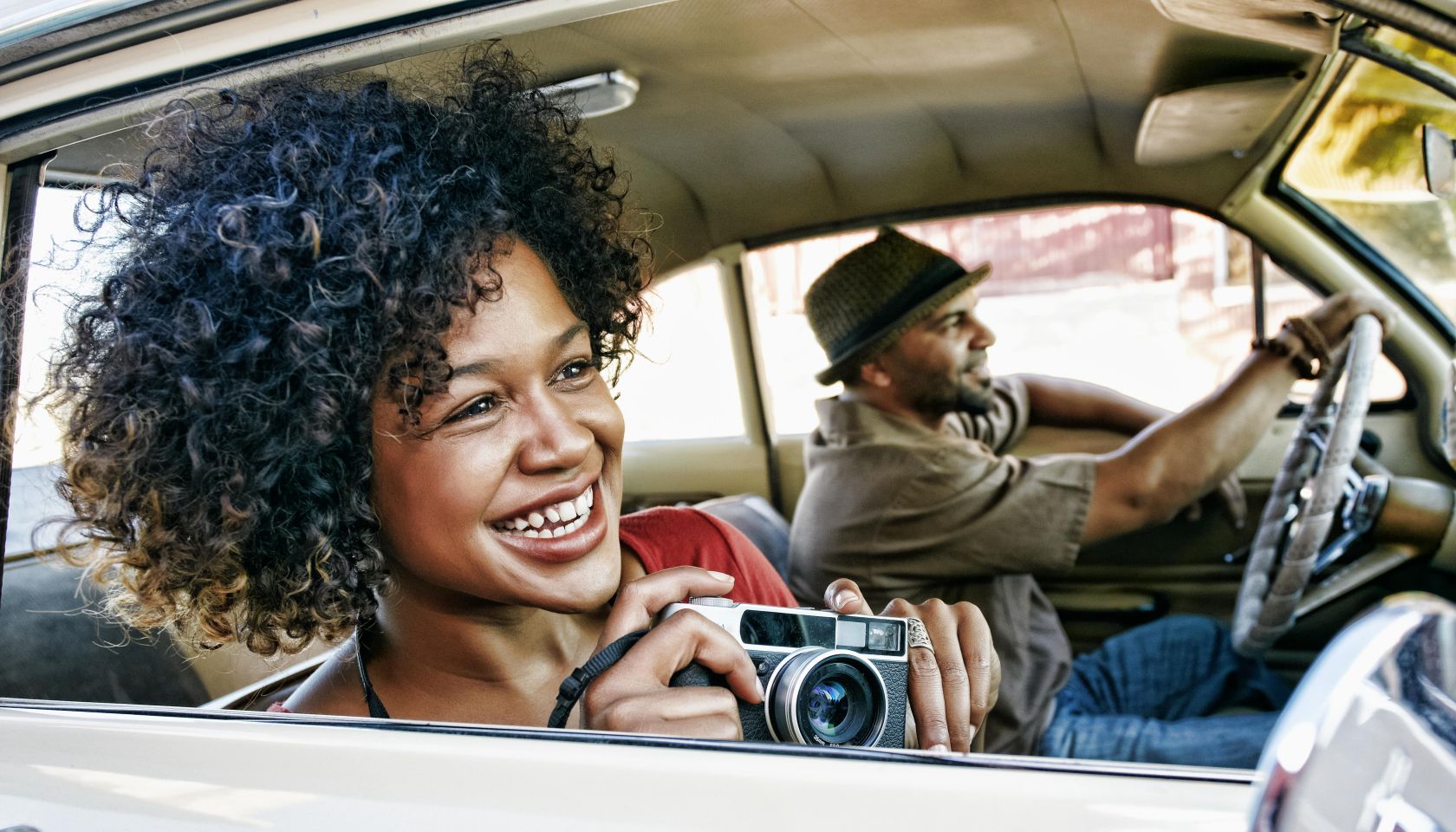 Couple driving in vintage car