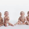 Portrait of Four Babies Sitting in Their Nappies