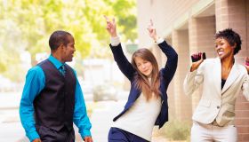 Office worker team does victory dance after receiving good news