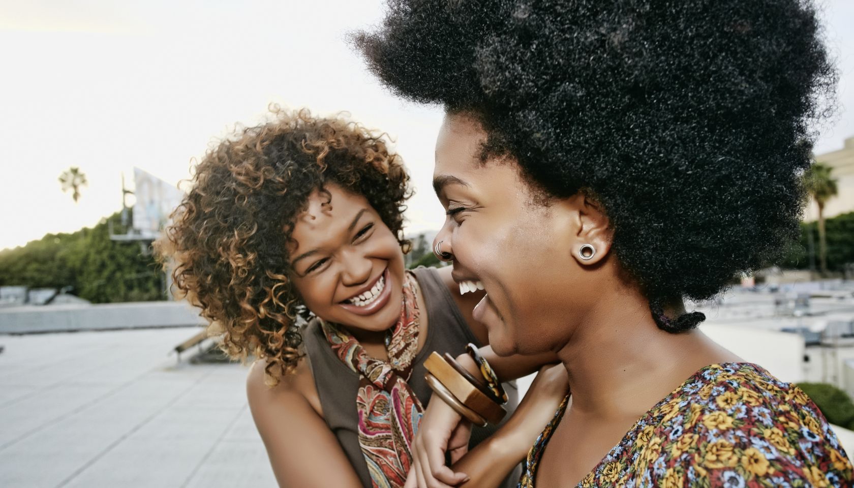 Women laughing on urban rooftop