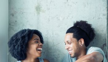 Portrait of young African American couple laughing