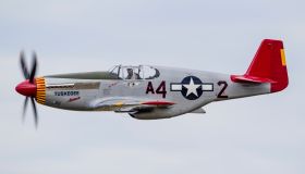 A P-51 Mustang flies by at EAA Airventure, Oshkosh, Wisconsin.
