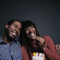 Laughing Couple Watching Movie