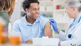 African American receives flu vaccine