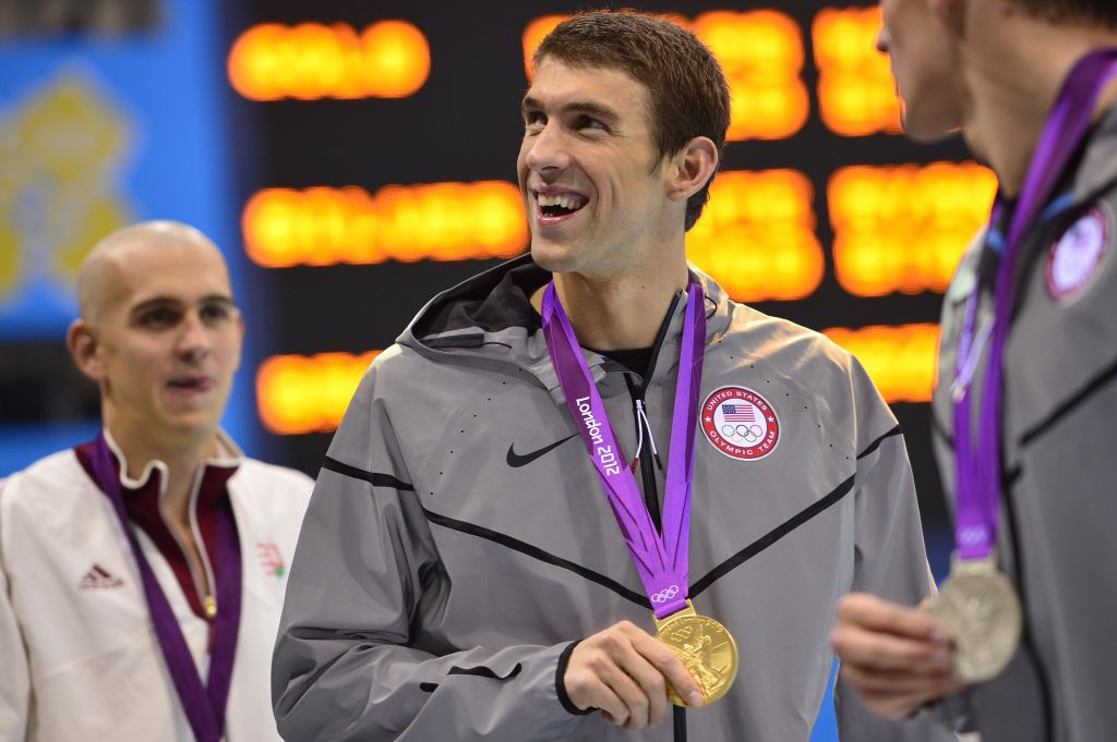 US swimmer Michael Phelps (C) shows off