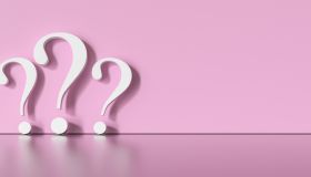 Question Mark Icon Against Pink Background