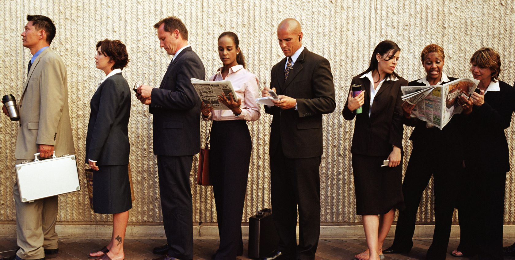 Group of businesspeople waiting in line
