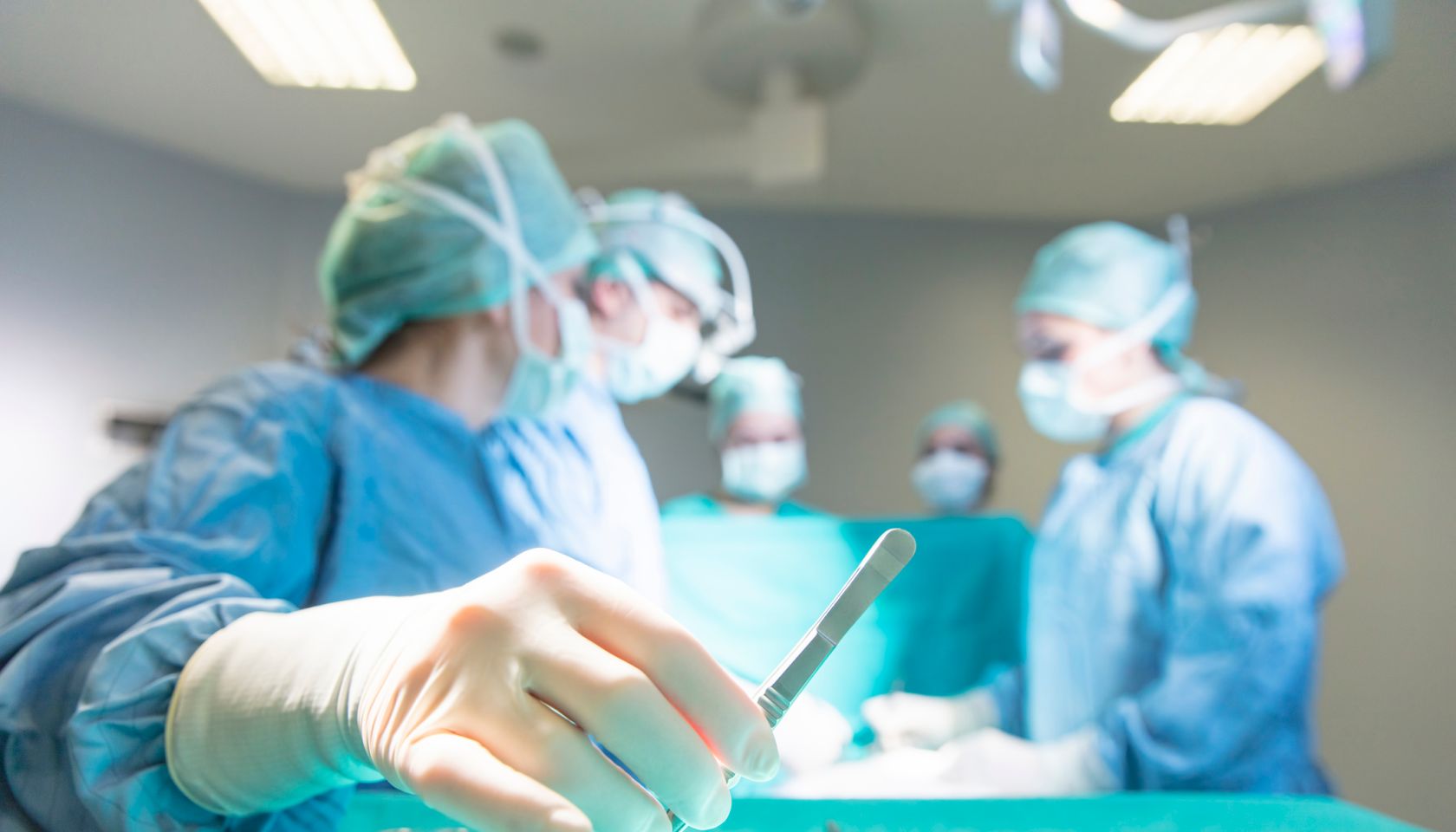 Surgeons in full surgical gear during operation