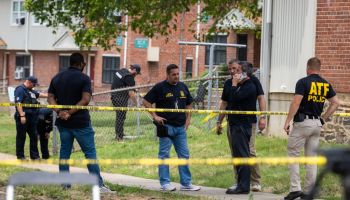 Authorities search for evidence at the scene of last nights mass shooting that left 2 dead and 20 wounded, on July 02 in Baltimore, MD.