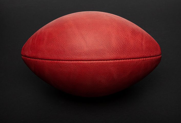 Football shot in studio on black background