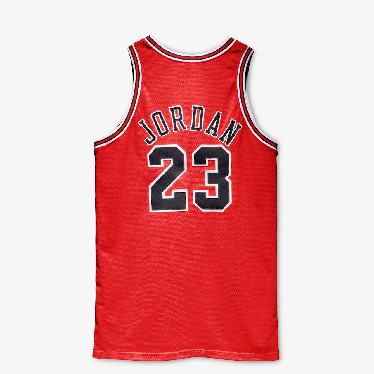 Red basketball jersey with the number 23 and the name "JORDAN" printed on it.